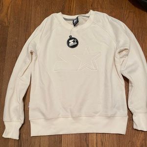 Cream crewneck sweatshirt with “Star Athletics” logo imprinted on front